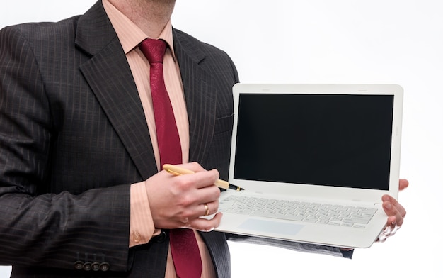 Man holding white laptop on white surface