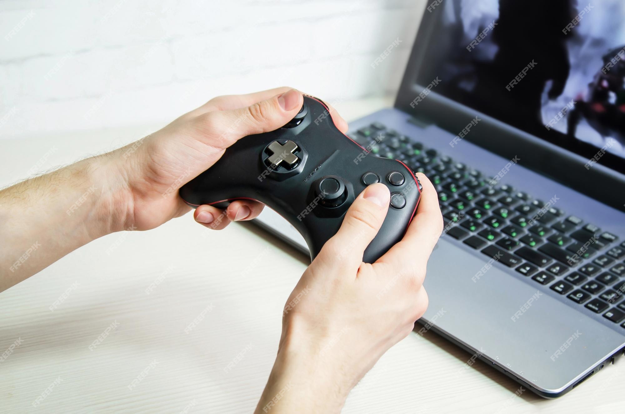 Still Life Of Game Controller On Laptop Symbol For Playing Online Games  High-Res Stock Photo - Getty Images