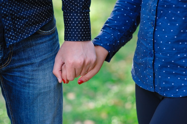 Man holding a woman's hand details