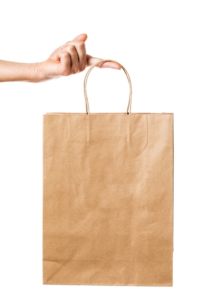 Man holds a bag of paper isolated on white background Biodegradable product