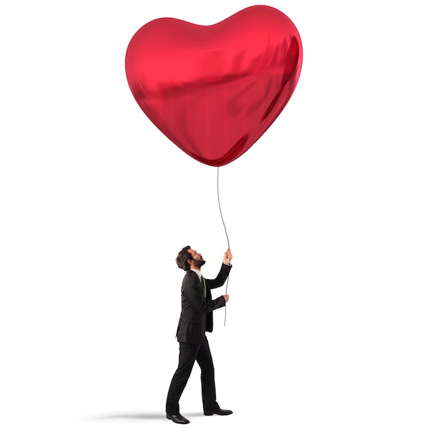 Man holds a big red heart balloon