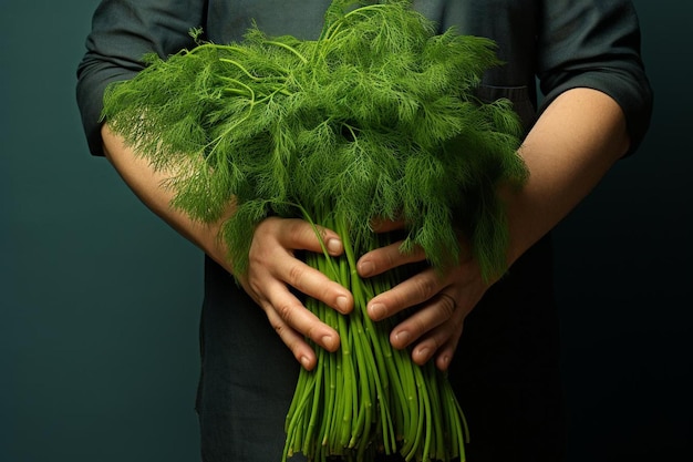 a man holds a bouquet of green flowers.