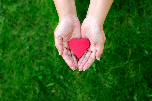 Man holds a heart in his hands