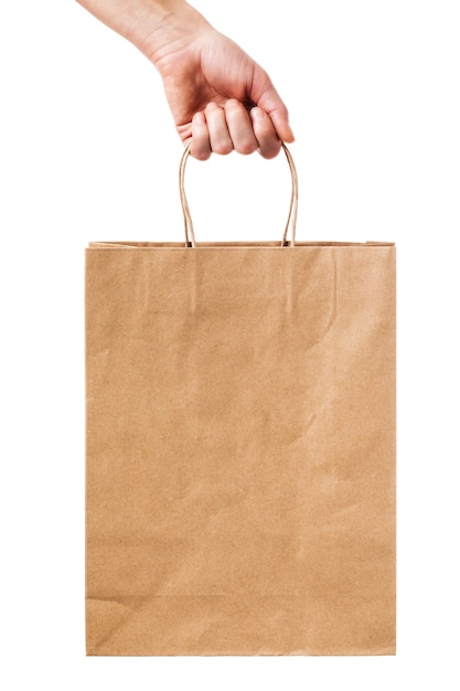 Man holds in his hand a package of paper isolated on white background