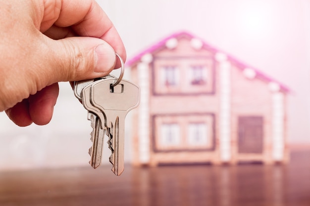 A man holds keys on a new home