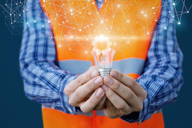 Photo a man holds a light bulb with the word light on it