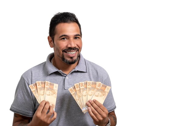 Man holds money Brazilian money BRL