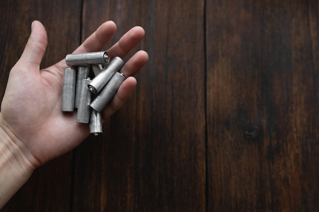 Man holds a used salt battery in his hand