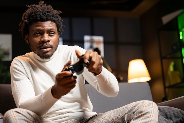 man in home theatre playing engaging videogame focused on defeating enemies