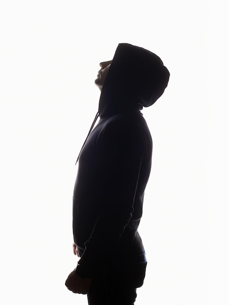 Photo man in hood boy in a hoodie male silhouette portrait