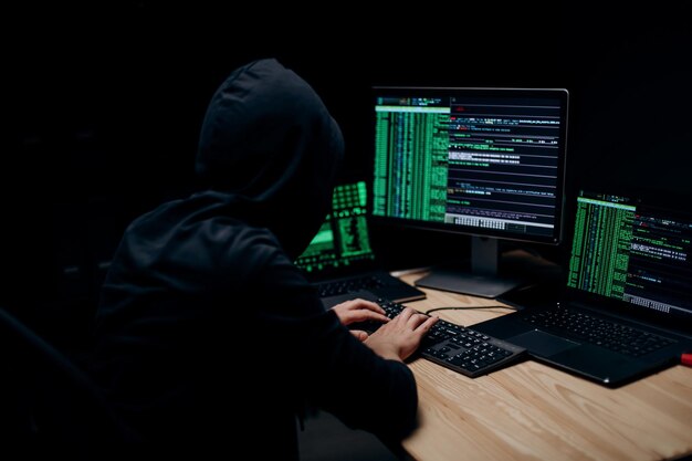 Man in hoodie hacking servers