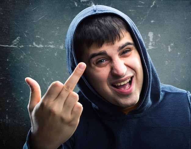 Man in hoodie with rude sign