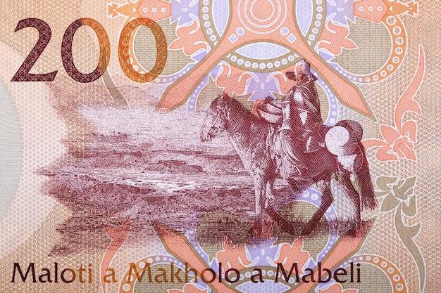 Uomo a cavallo dalle banconote del lesotho