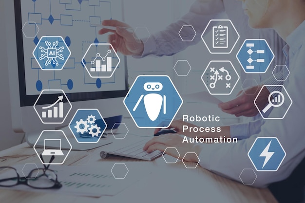 a man is giving a presentation with the words robotic process automation on it.