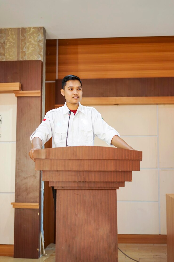 Man is giving a speech on the pulpit