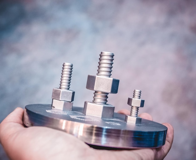 Man is holding object printed on metal 3d printer