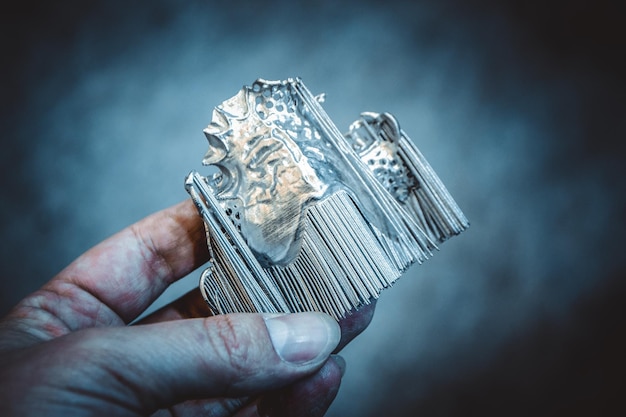 Man is holding object printed on metal 3d printer