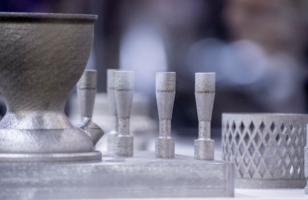 Man is holding object printed on metal 3d printer