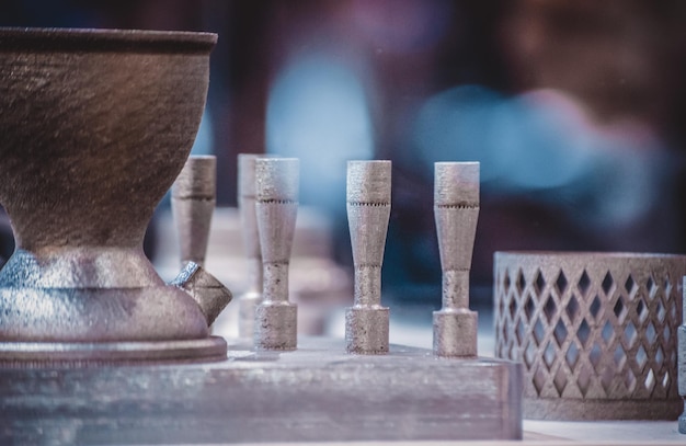 Man is holding object printed on metal 3d printer