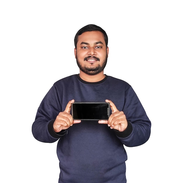 A man is holding a phone in both hands.