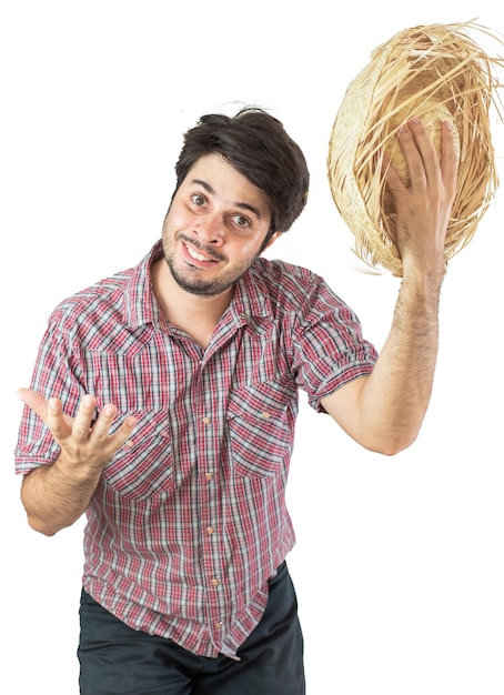 A man is holding a straw hat with the word no on it