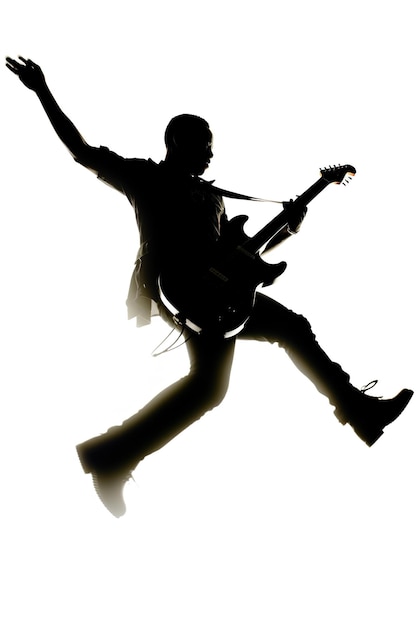 A man is jumping with a guitar in front of a white background.