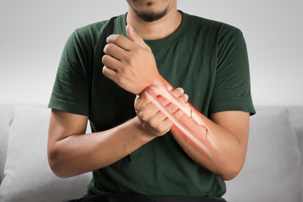 A man is in pain because of a broken forearm bone