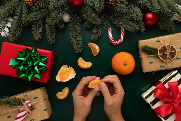 The man is peeling tangerines