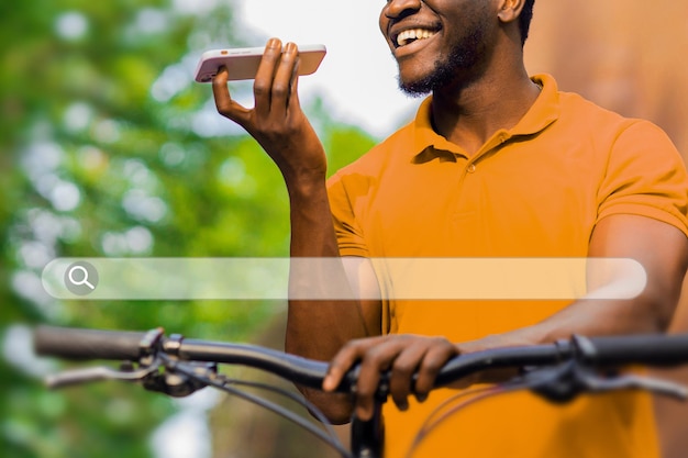 a man is riding a bicycle and talking on his cell phone