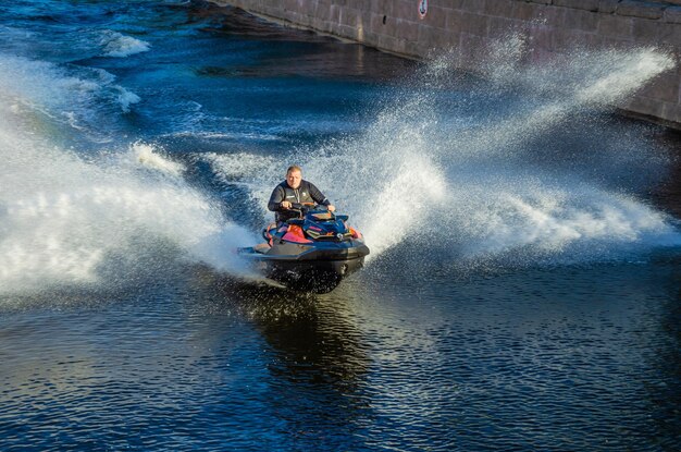 A man is riding a jet ski in the water