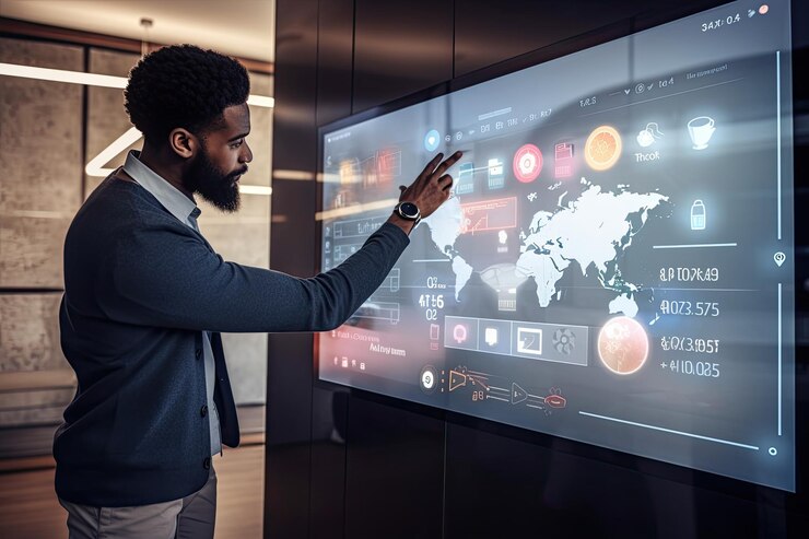A man is standing in front of a projection screen
