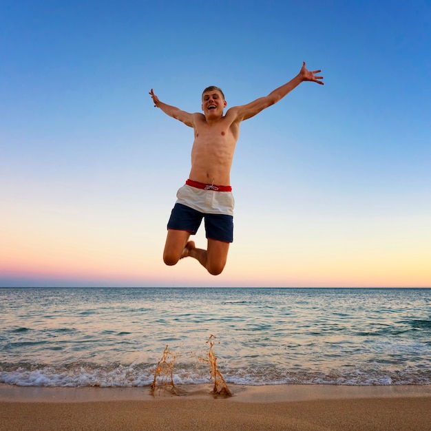 Man jumping at Camilo beach, Portugal