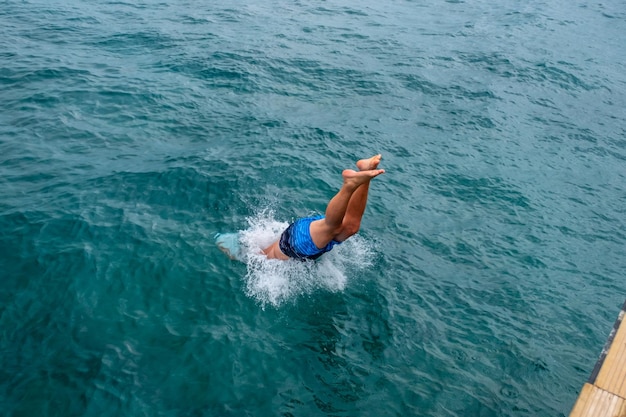 Man jumping inside the ocean