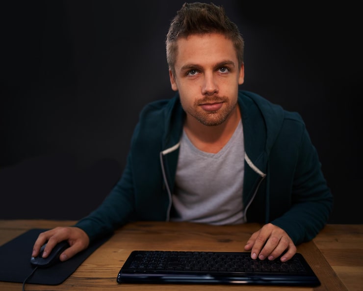 Photo man keyboard for code and programmer typing information technology with video game or software development internet computer programming and face with gamer or developer for cyber security