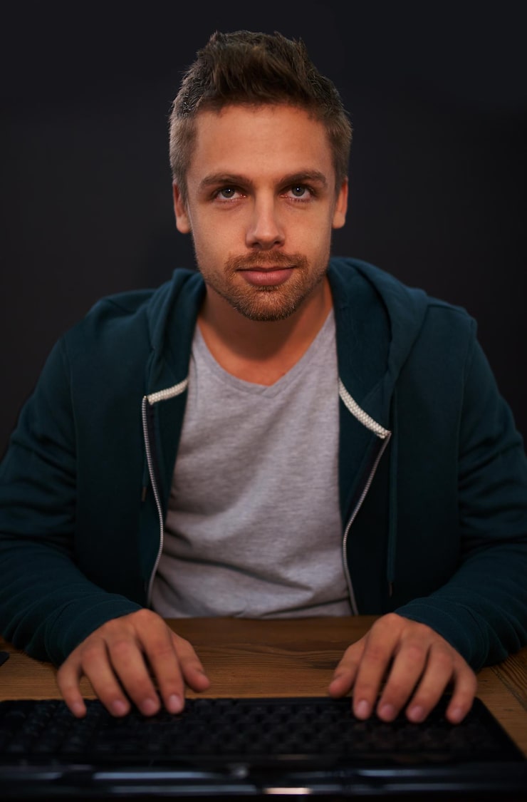 Photo man keyboard for coding and programmer typing information technology with video game or software development internet computer programming and face with gamer or developer for cyber security