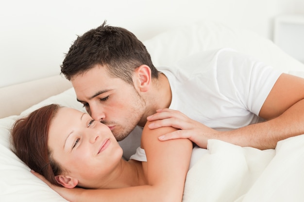 Man kissing his wife on the cheek