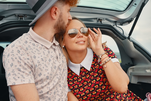 Man kissing with affection forehead of his beautiful girlfriend