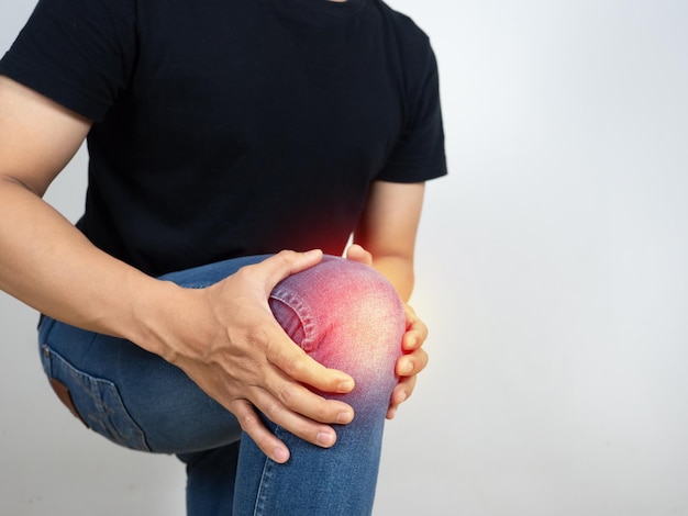 Man kneel hold his knee feels hurt from sport