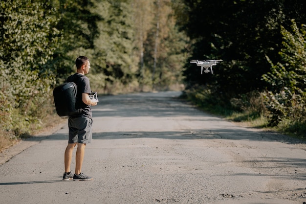 Man launching drone in summer