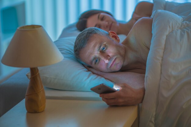 The man lay with woman and phone