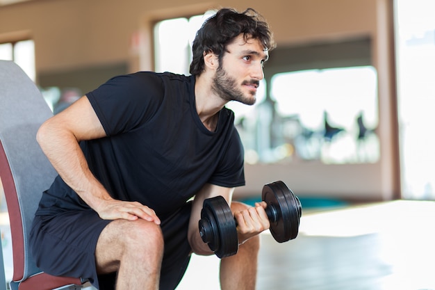 Man lifting weight at the gym