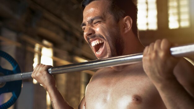 A man lifting weights in a gym