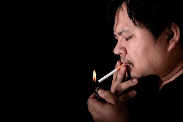 Man lighting up a cigarette with lighter