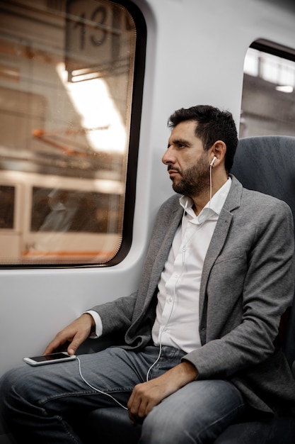 Man listening to music from his cellphone