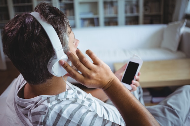 man listening to music on headphones