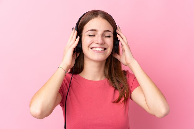 Man listening music over isolated wall