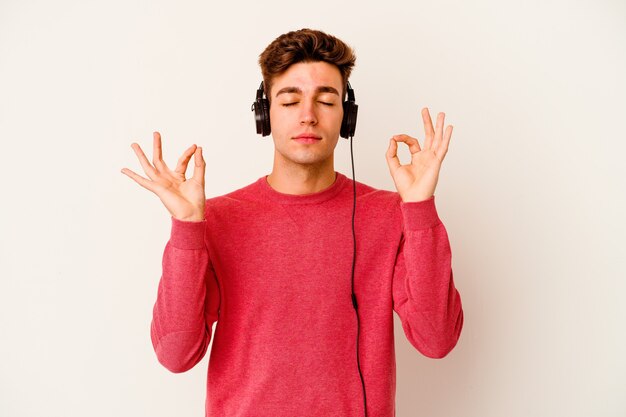 man listening to music isolated on white