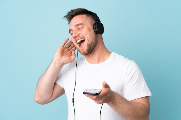 Man listening music over isolated