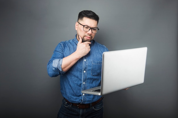 A man looked at the computer in surprise.