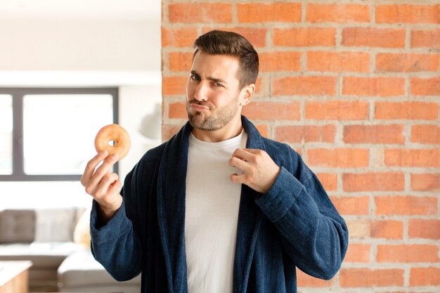 man looking arrogant, successful, positive and proud, pointing to self